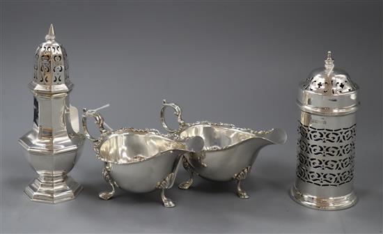 A pierced silver cylindrical sugar caster with blue glass liner, an urn-shaped caster and a pair of sauceboats approx 13oz